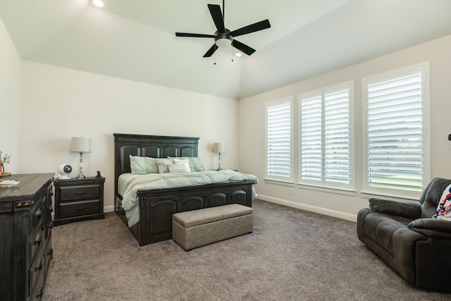 carpeted bedroom featuring multiple windows, lofted ceiling, and ceiling fan