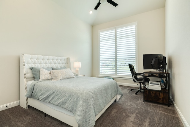 carpeted bedroom with vaulted ceiling and ceiling fan