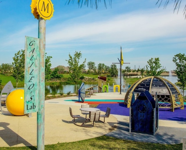 view of play area with a water view