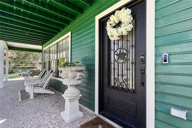 entrance to property with a porch