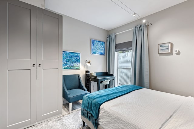 bedroom featuring hardwood / wood-style floors