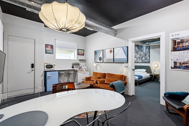 view of carpeted dining space