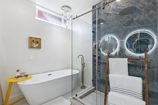 bathroom featuring shower with separate bathtub