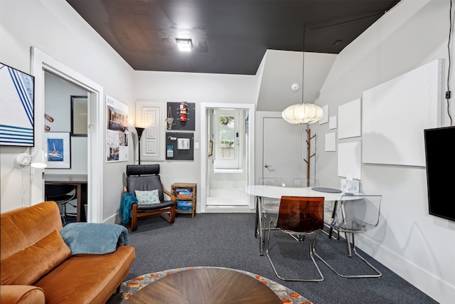 interior space featuring carpet floors and vaulted ceiling