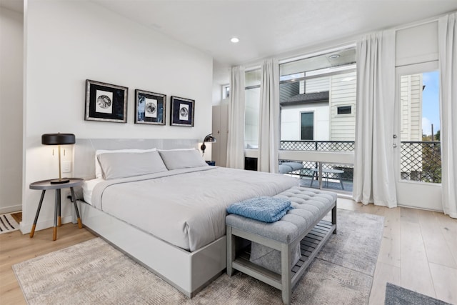 bedroom featuring access to outside and light hardwood / wood-style flooring