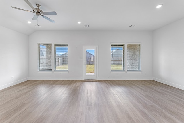 unfurnished living room with light hardwood / wood-style floors, ceiling fan, and a healthy amount of sunlight