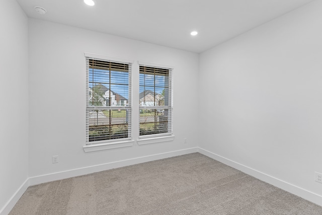 unfurnished room with carpet flooring