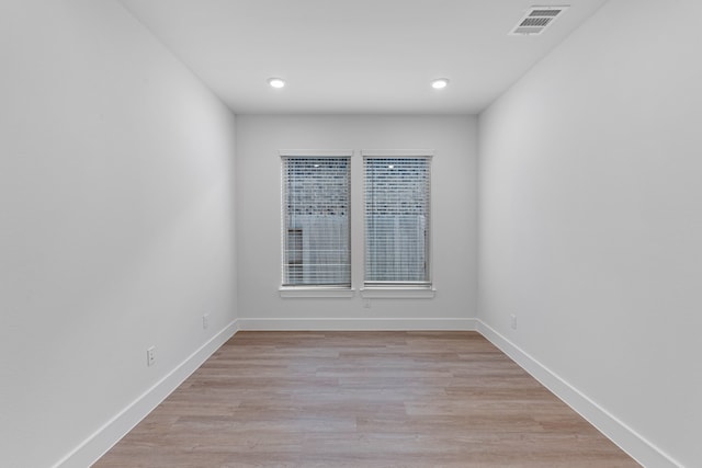 spare room featuring light hardwood / wood-style flooring