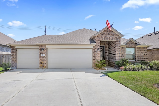 ranch-style home featuring a garage and a front lawn