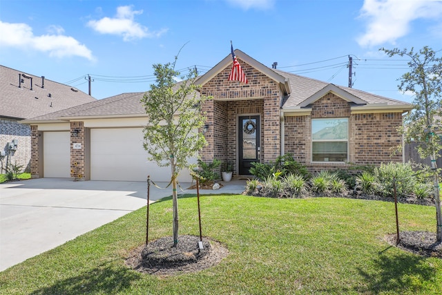 view of front facade with a front yard and a garage