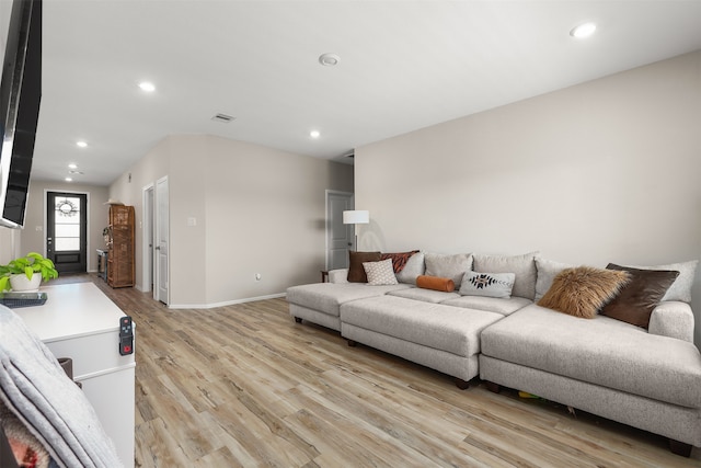 living room with light hardwood / wood-style flooring