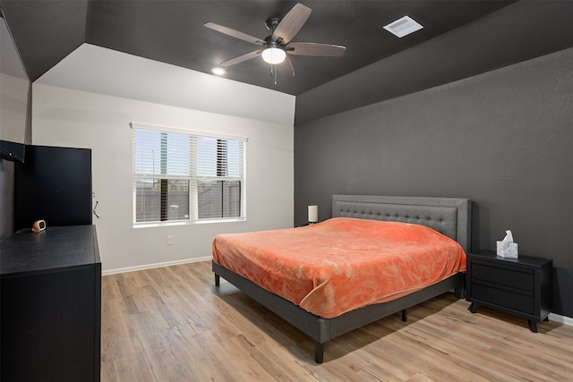 bedroom with light hardwood / wood-style floors and ceiling fan