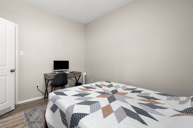 bedroom featuring hardwood / wood-style flooring