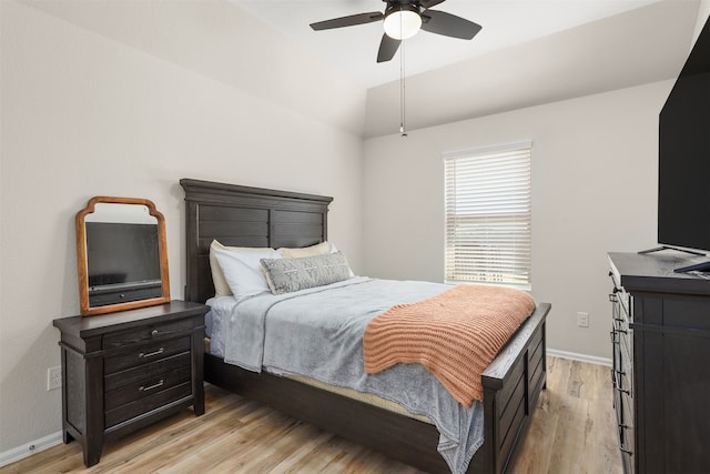 bedroom with light hardwood / wood-style flooring and ceiling fan