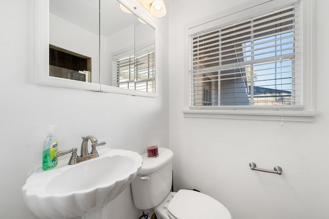 bathroom with toilet and sink