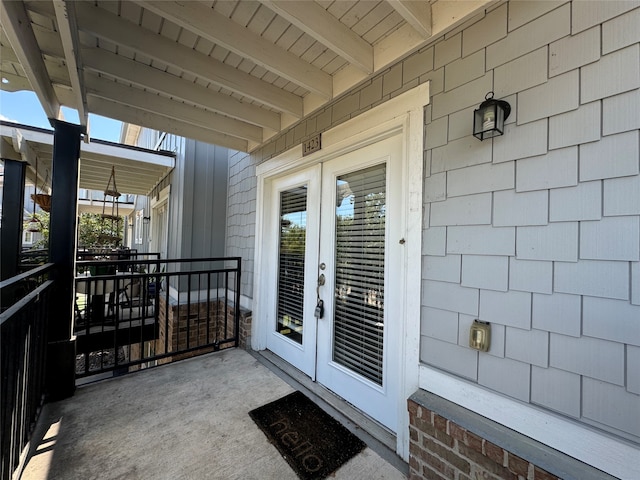 view of exterior entry featuring french doors