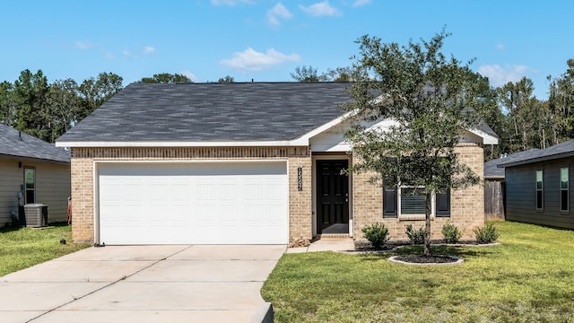 view of front of home with a garage, a front lawn, and central air condition unit