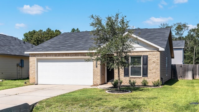 view of front facade with a front yard and a garage