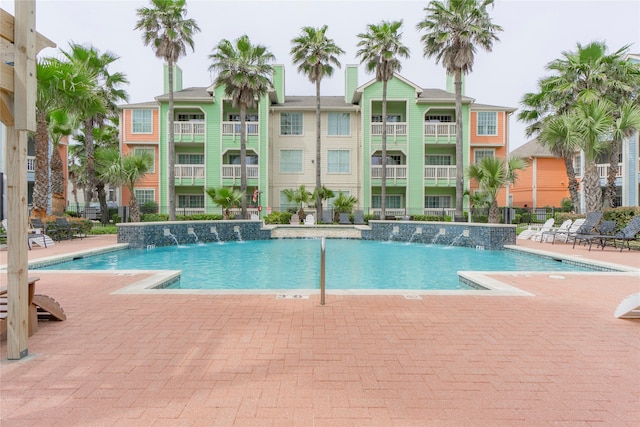 view of pool featuring pool water feature