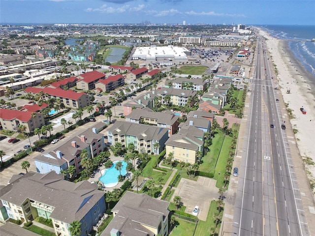 birds eye view of property with a view of the beach and a water view