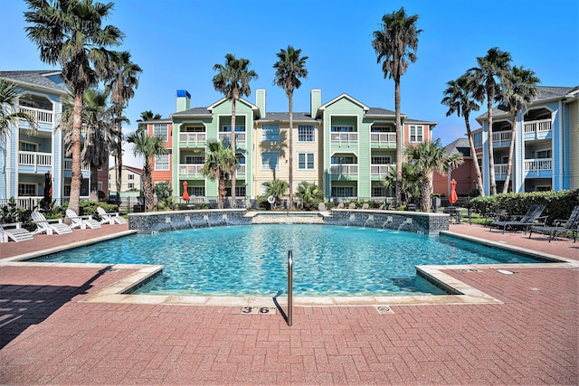 view of swimming pool featuring pool water feature