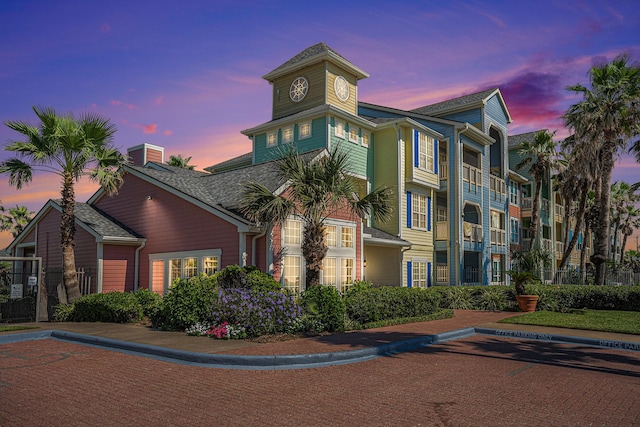 view of outdoor building at dusk