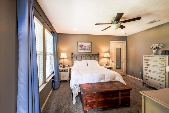 bedroom featuring dark colored carpet and ceiling fan