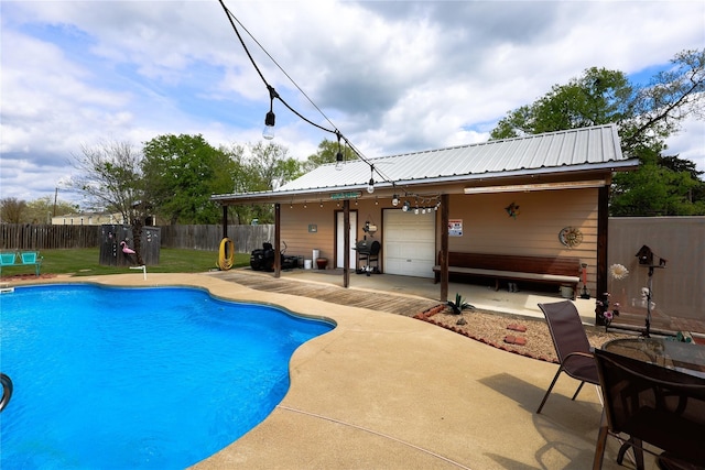 view of swimming pool featuring a patio and area for grilling