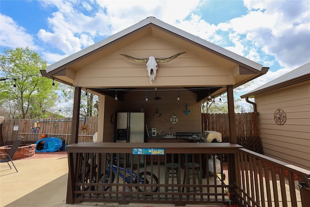 deck with sink and a patio area