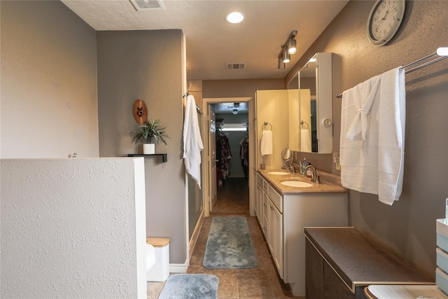 bathroom featuring tile patterned floors and vanity