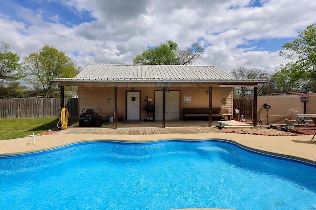 view of pool with ceiling fan and a patio area