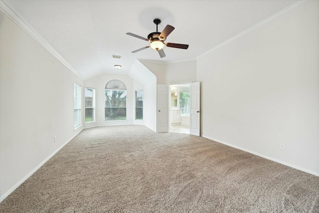 unfurnished living room with ceiling fan, carpet floors, lofted ceiling, and ornamental molding