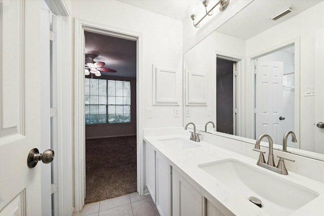 bathroom with tile patterned floors, ceiling fan, and vanity