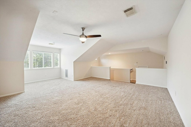 bonus room featuring ceiling fan, carpet, and lofted ceiling