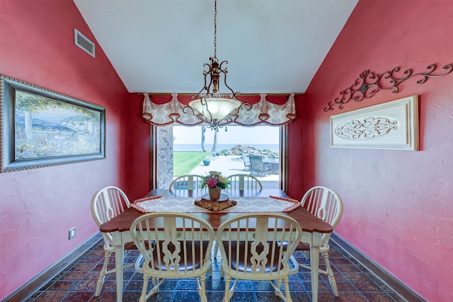 dining space with lofted ceiling