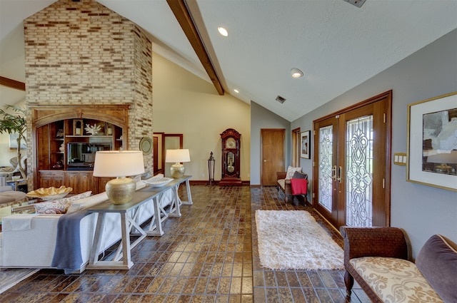 foyer entrance with french doors and vaulted ceiling with beams