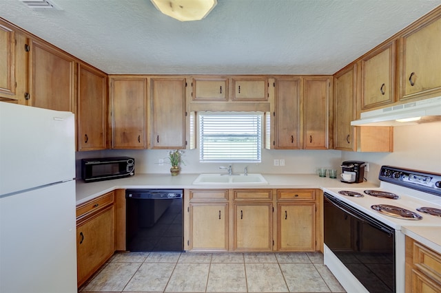 kitchen featuring light tile patterned floors, a textured ceiling, black appliances, and sink