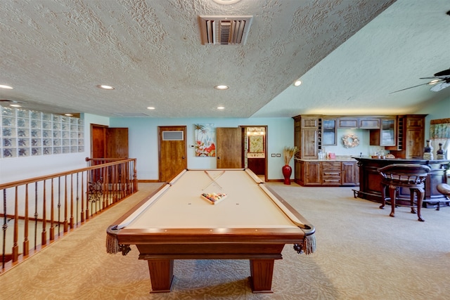 playroom featuring light carpet, a textured ceiling, billiards, and a wealth of natural light