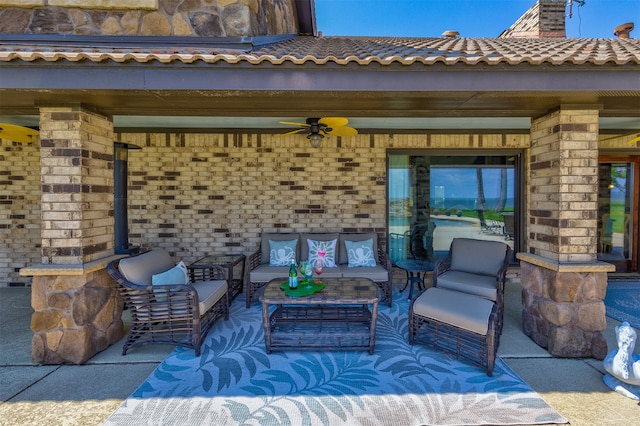 view of patio with outdoor lounge area and ceiling fan