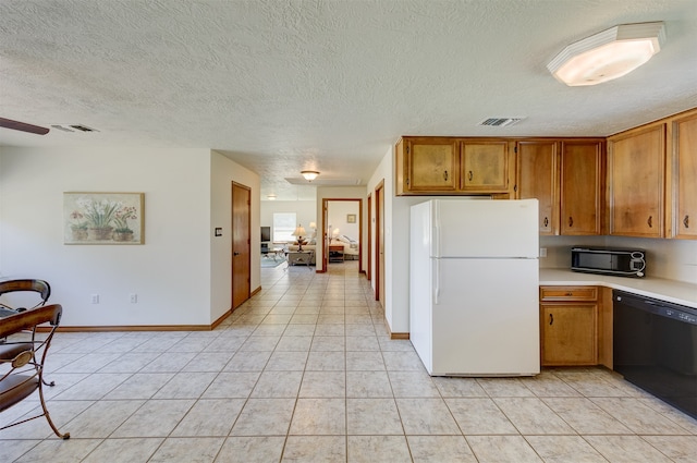 kitchen with ceiling fan, light tile patterned floors, a textured ceiling, dishwasher, and white refrigerator