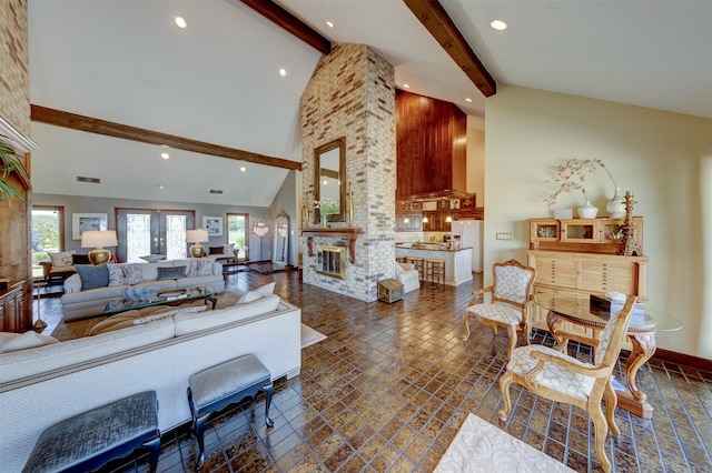 living room with french doors, a large fireplace, high vaulted ceiling, and beamed ceiling