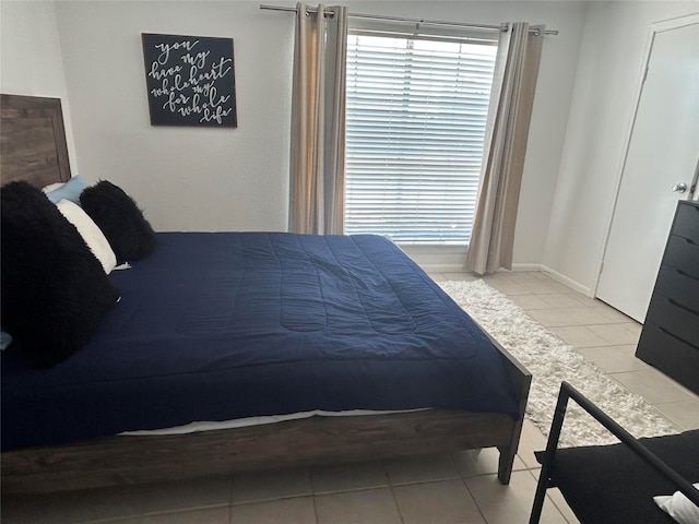 bedroom with tile patterned floors