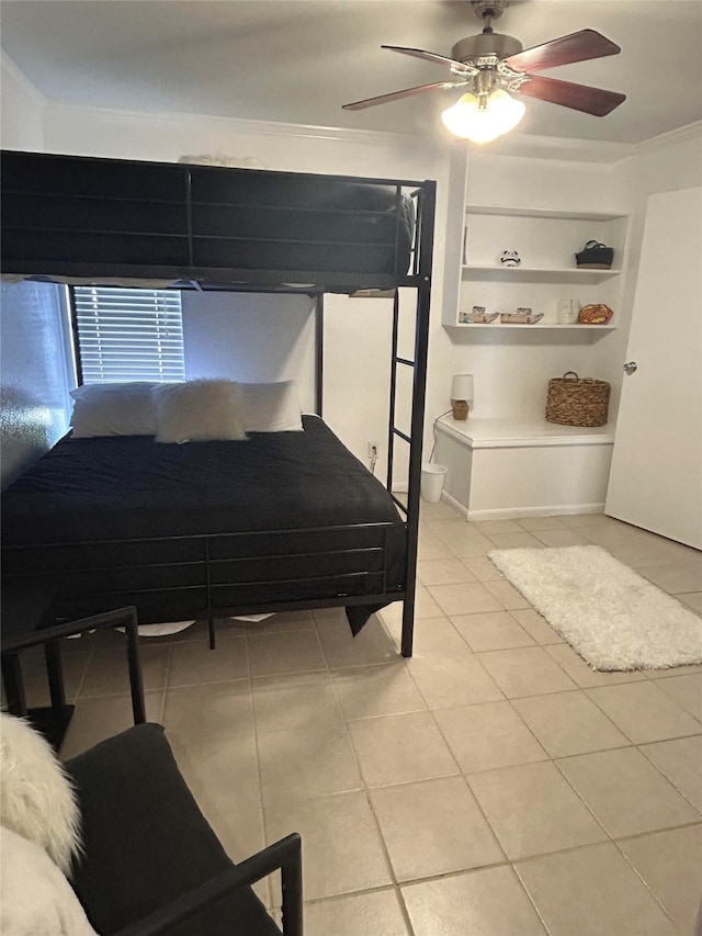 bedroom with ornamental molding, ceiling fan, and light tile patterned floors