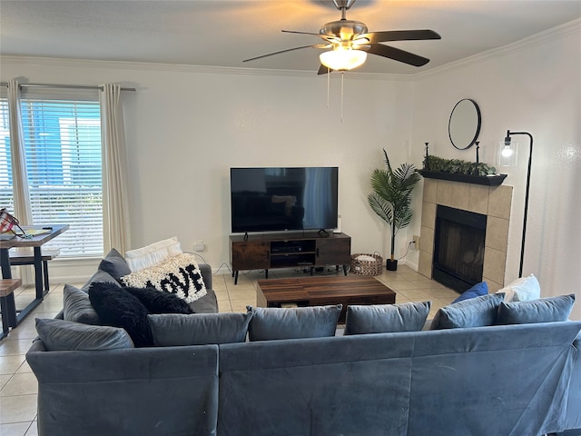 living room with a fireplace, light tile patterned flooring, and ceiling fan