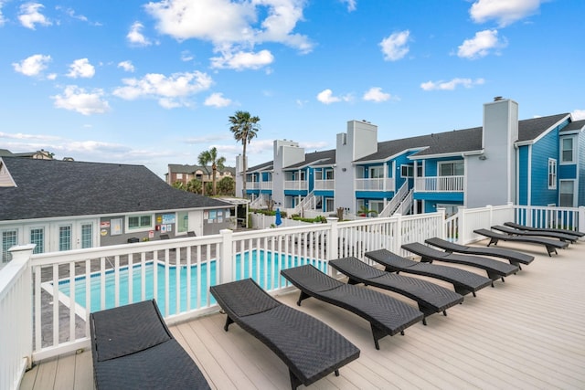 view of swimming pool with a wooden deck