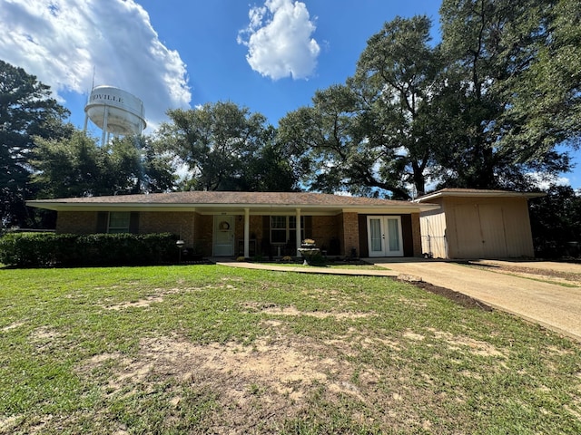 ranch-style house with a front lawn