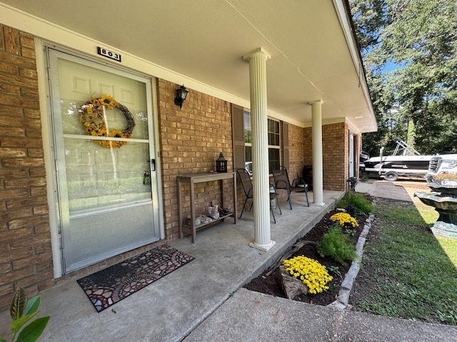 entrance to property with brick siding