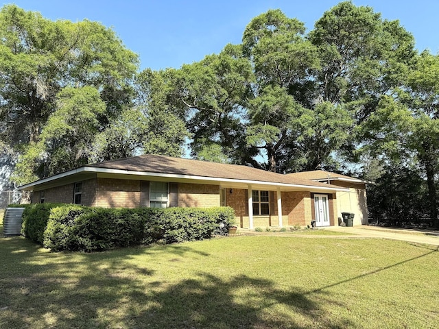 single story home with a front yard and brick siding