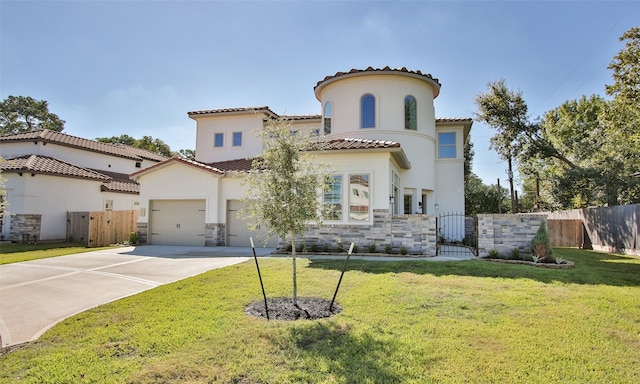 mediterranean / spanish home featuring a front yard