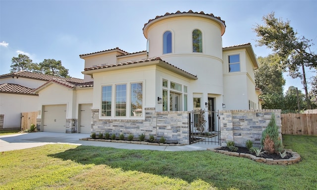 rear view of property featuring a garage and a yard